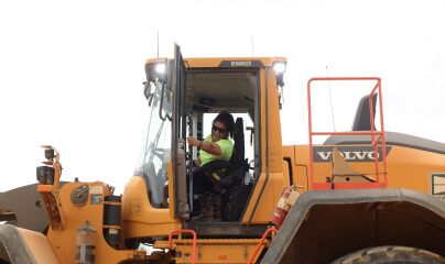team member working on loader